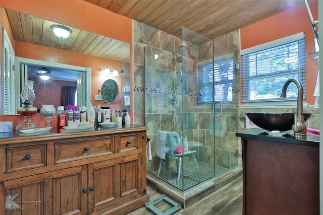 bathroom with walk in shower, vanity, and wooden ceiling