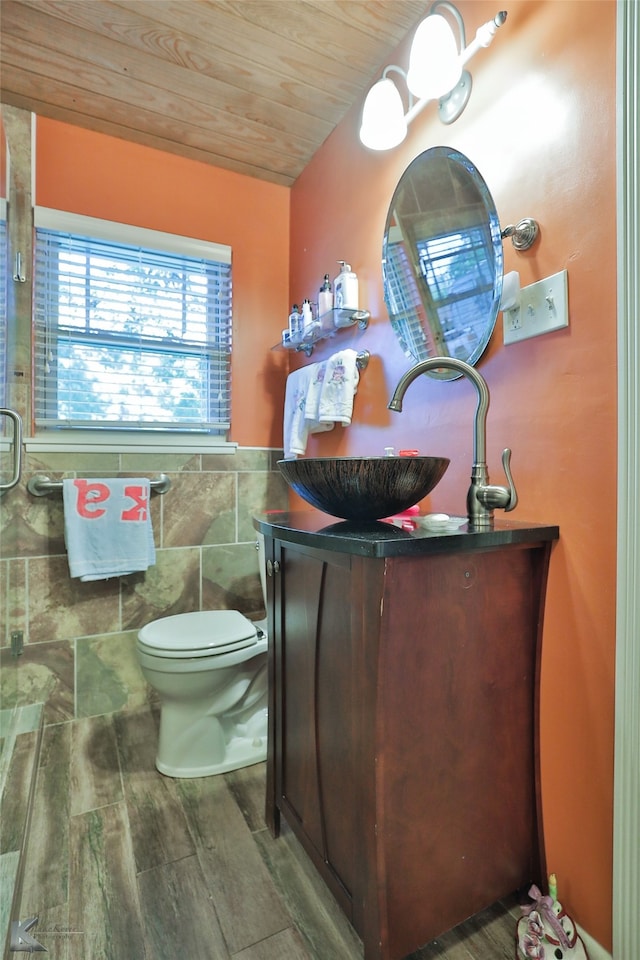 bathroom with toilet, vanity, wood ceiling, and wood-type flooring