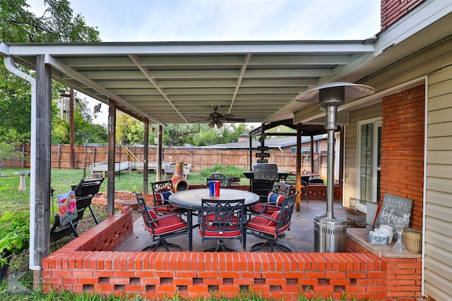 view of patio with a grill and ceiling fan