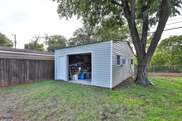 view of outbuilding with a yard