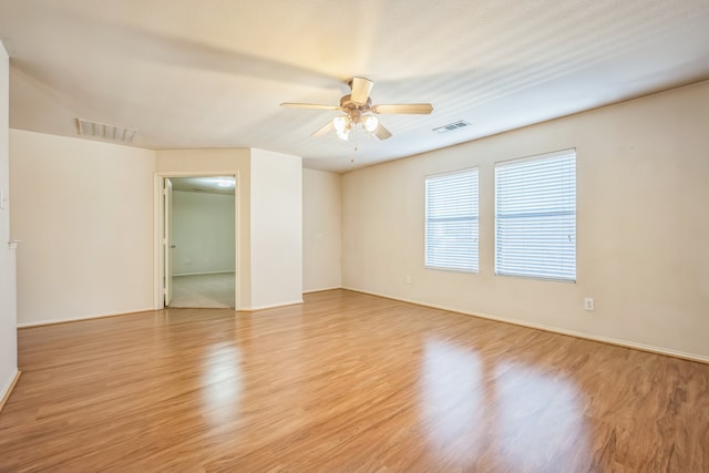 spare room featuring ceiling fan and light hardwood / wood-style flooring