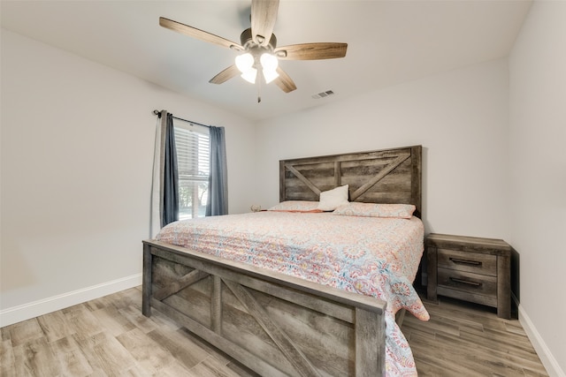 bedroom featuring hardwood / wood-style floors and ceiling fan