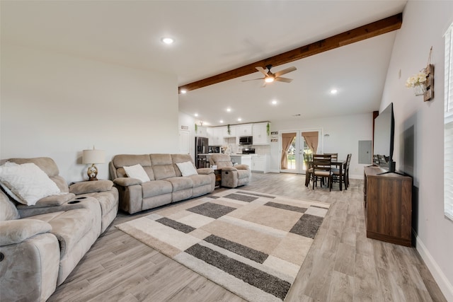 living room featuring french doors, vaulted ceiling with beams, light hardwood / wood-style flooring, and ceiling fan