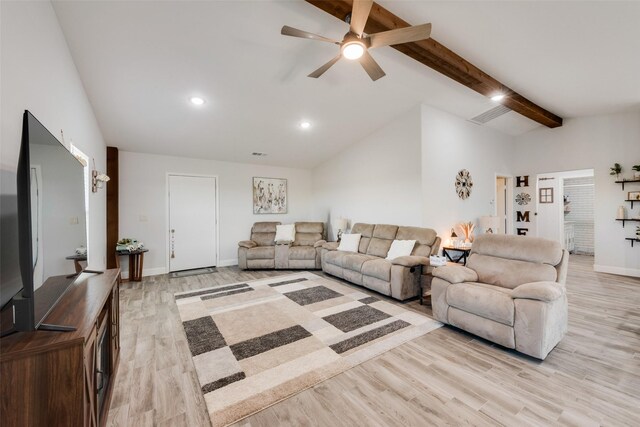 living room with vaulted ceiling with beams, ceiling fan, and light hardwood / wood-style flooring