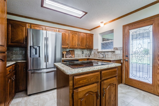 kitchen featuring black electric stovetop, stainless steel fridge with ice dispenser, ornamental molding, a kitchen island, and backsplash