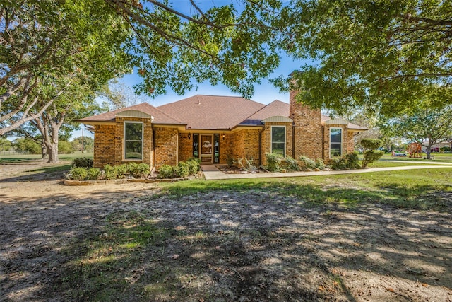 ranch-style home with a front yard