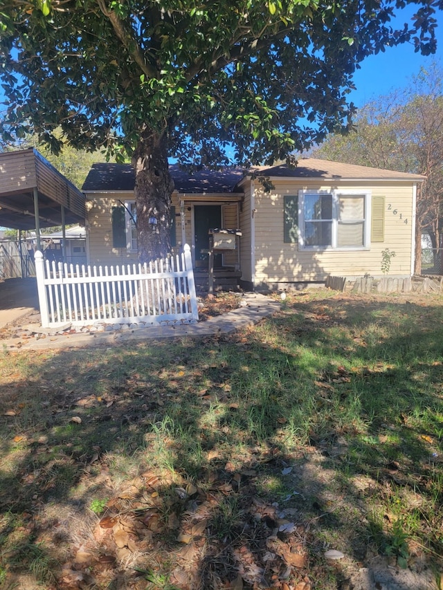 view of front of house featuring a carport