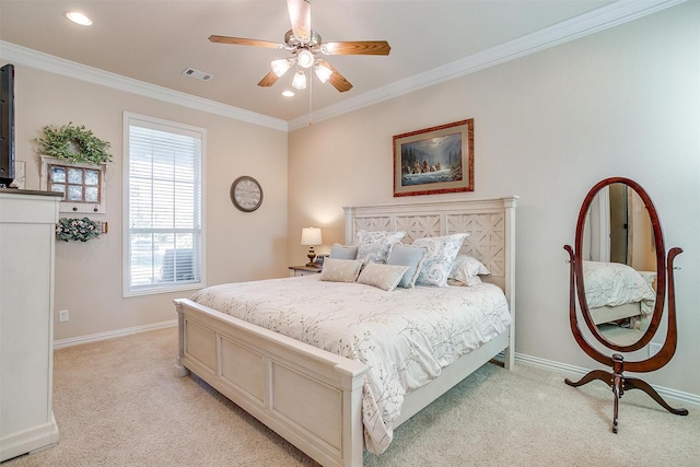 carpeted bedroom with ceiling fan and ornamental molding