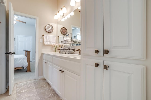 bathroom featuring vanity and ceiling fan