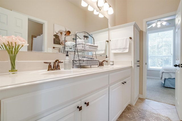 bathroom with tile patterned floors, a shower with curtain, and vanity