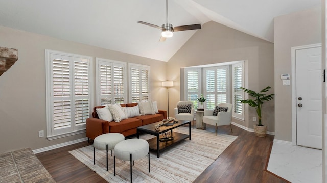 living room featuring dark hardwood / wood-style flooring, high vaulted ceiling, and ceiling fan