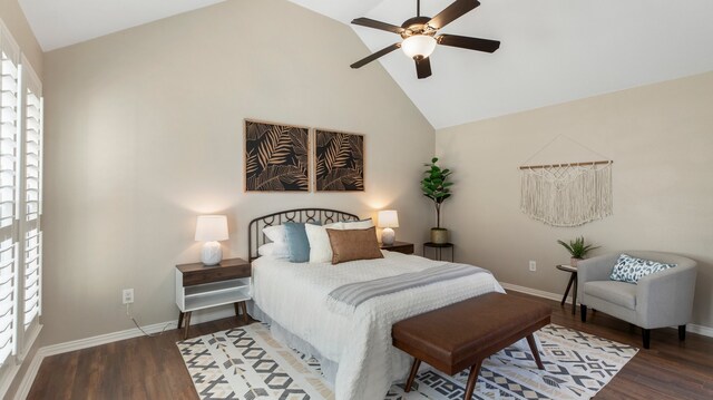 bedroom with ceiling fan, high vaulted ceiling, and dark wood-type flooring