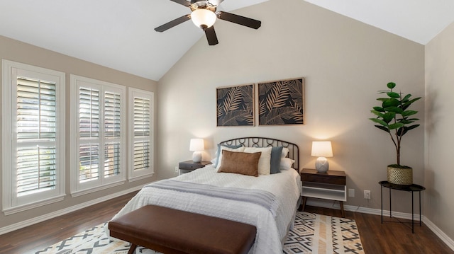 bedroom featuring dark hardwood / wood-style flooring, high vaulted ceiling, and ceiling fan