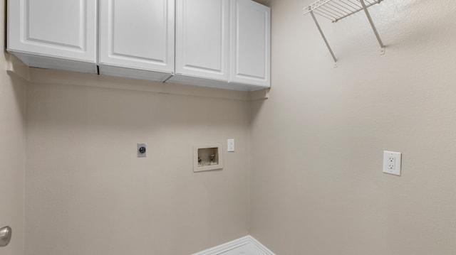 washroom featuring cabinets, hookup for a washing machine, and electric dryer hookup