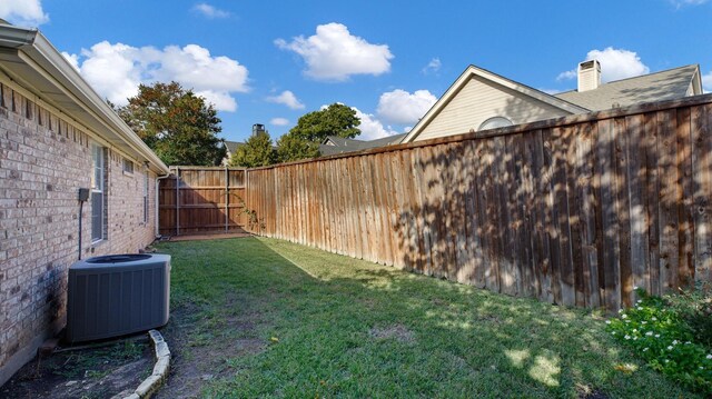 view of yard with central AC unit