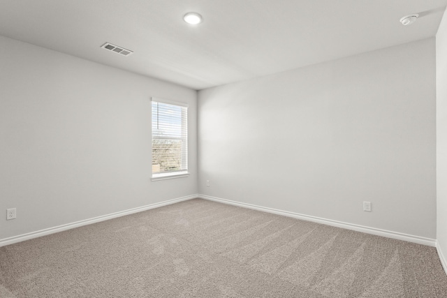 spare room featuring carpet flooring