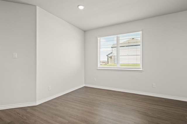 empty room featuring dark hardwood / wood-style floors