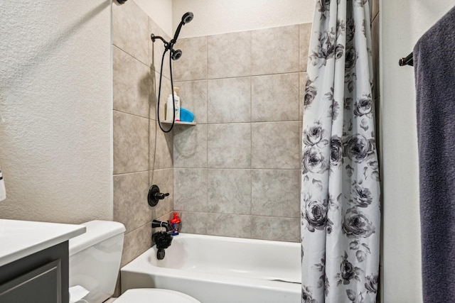 full bathroom featuring vanity, shower / tub combo, and toilet