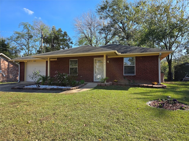 single story home featuring a front lawn and a garage