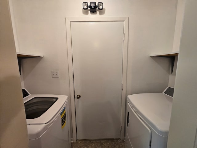 washroom with independent washer and dryer