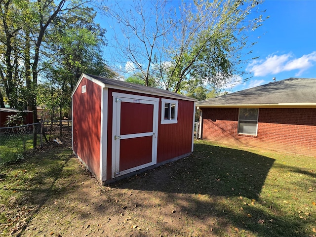 view of outbuilding featuring a yard