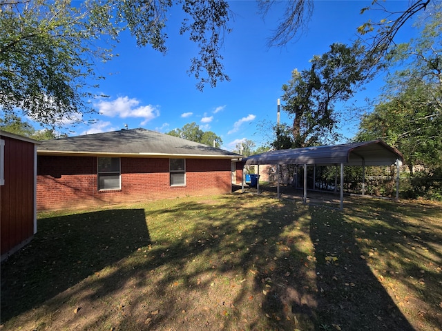 view of yard with a carport