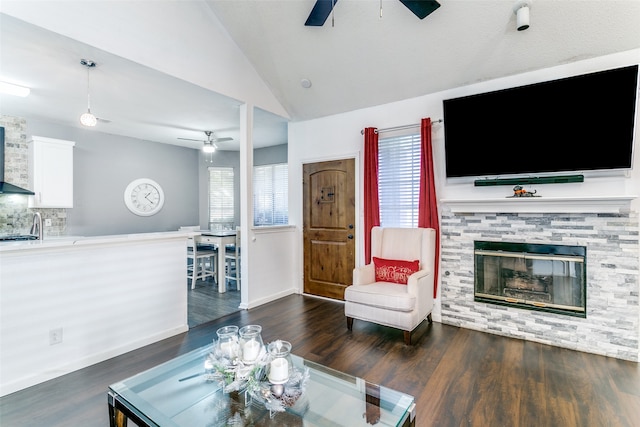 living room featuring ceiling fan, lofted ceiling, and dark hardwood / wood-style floors