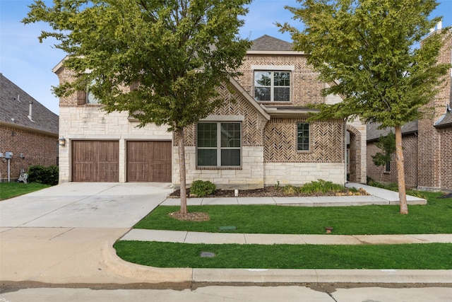 view of front of house with a garage and a front yard