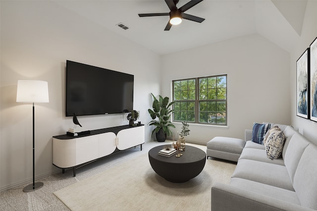 carpeted living room with lofted ceiling and ceiling fan