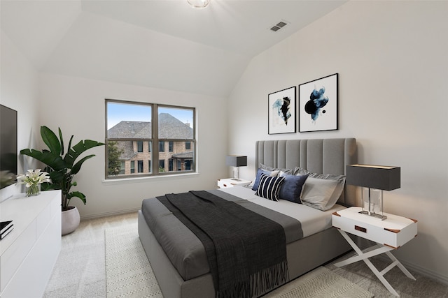 carpeted bedroom featuring vaulted ceiling