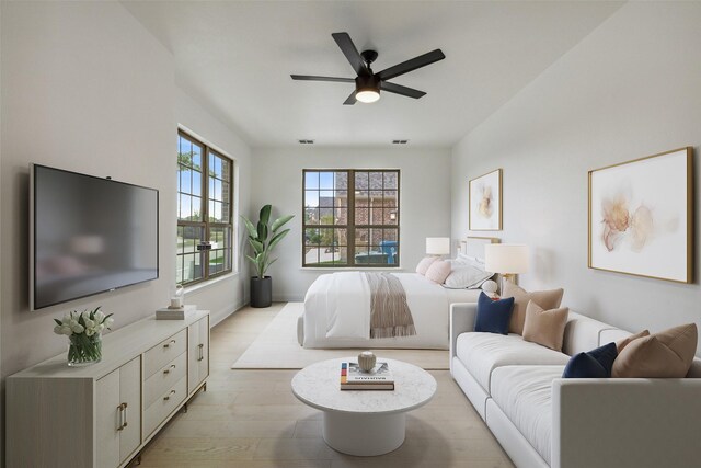 bedroom featuring light hardwood / wood-style flooring and ceiling fan