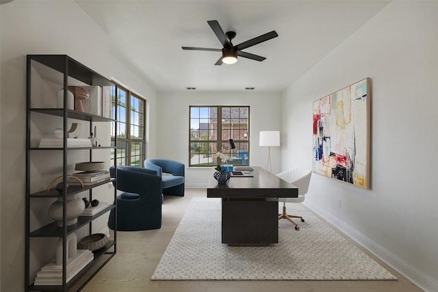 office area with ceiling fan and light wood-type flooring