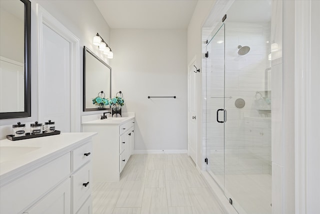 bathroom with a shower with door and vanity