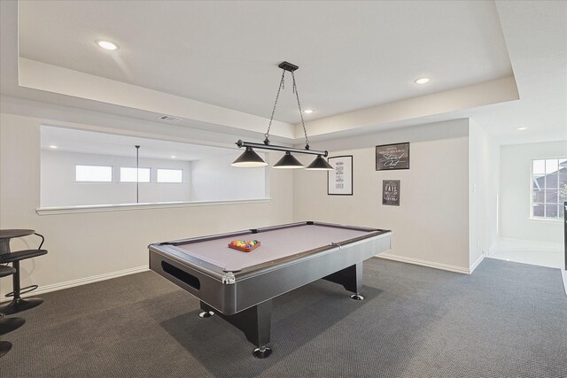 recreation room with a raised ceiling, dark carpet, and pool table