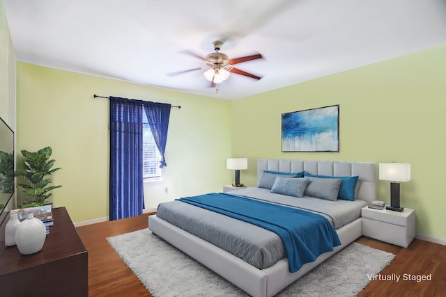 bedroom with dark wood-type flooring and ceiling fan