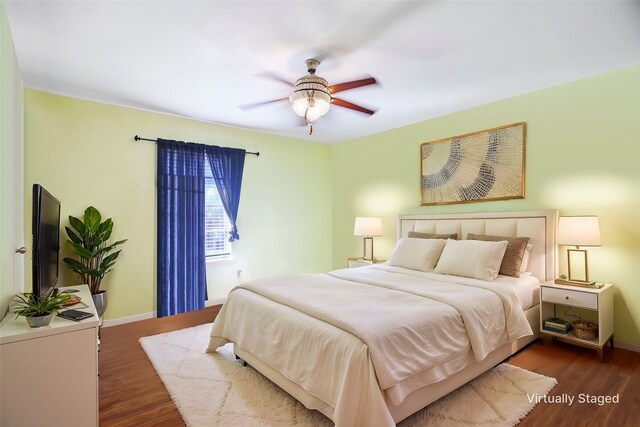 spare room featuring wood-type flooring and ceiling fan