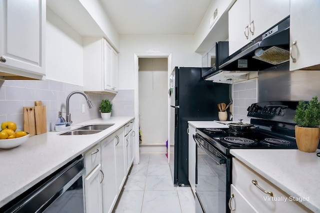 kitchen with white cabinetry, sink, black appliances, and tasteful backsplash