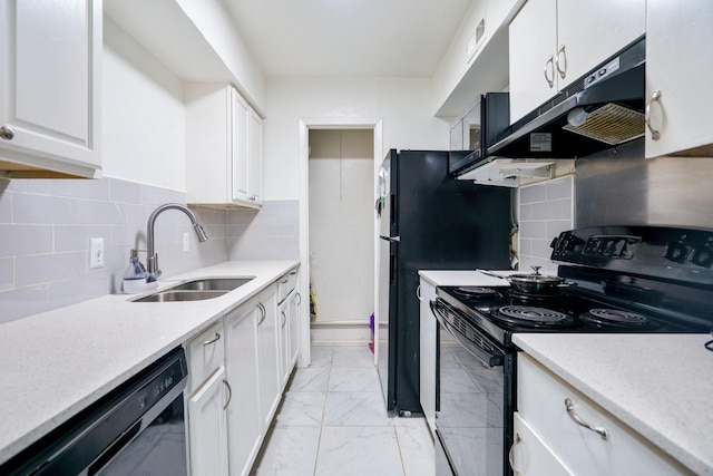 kitchen with marble finish floor, under cabinet range hood, black appliances, white cabinetry, and a sink