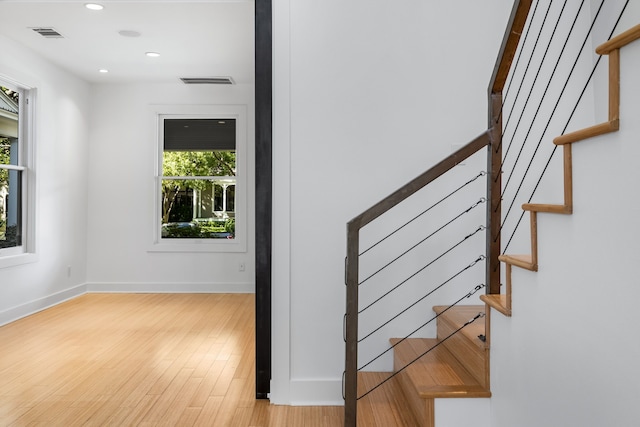 stairway with wood-type flooring