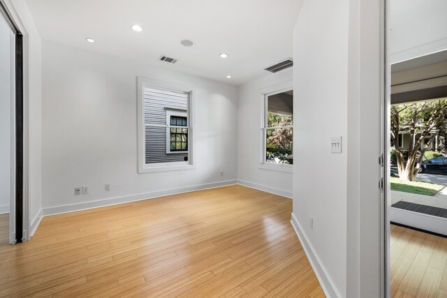 spare room featuring light wood-type flooring