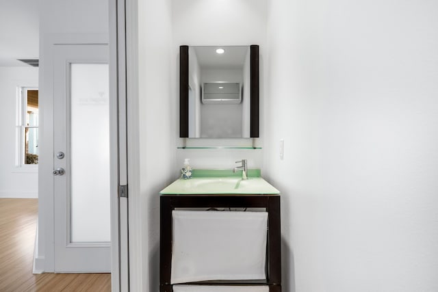 bathroom featuring vanity and wood-type flooring