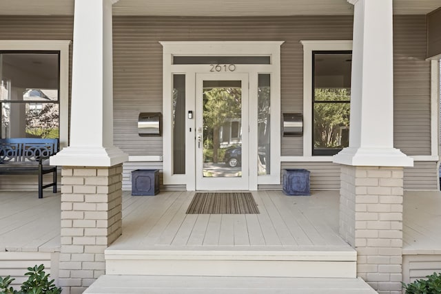 doorway to property with a porch