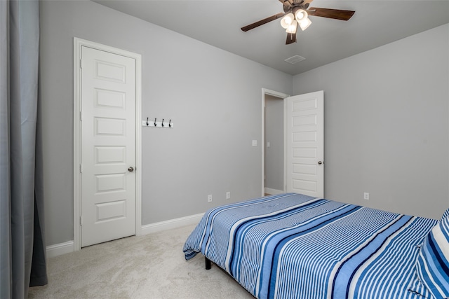 bedroom with light carpet and ceiling fan