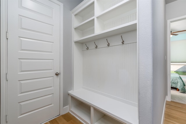 mudroom with light hardwood / wood-style flooring and ceiling fan