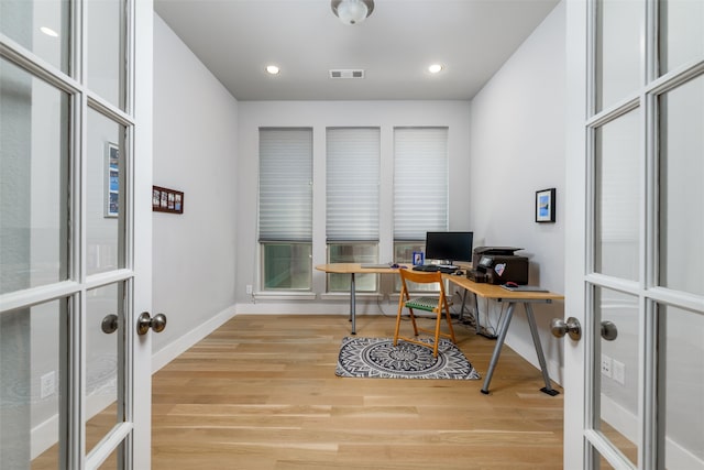 office area featuring french doors and light hardwood / wood-style flooring