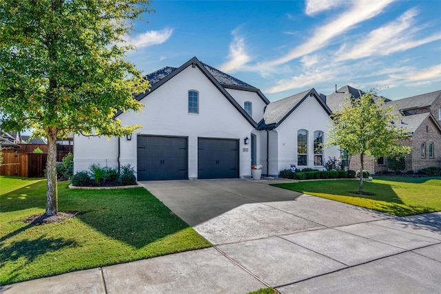 french country inspired facade with a garage and a front yard