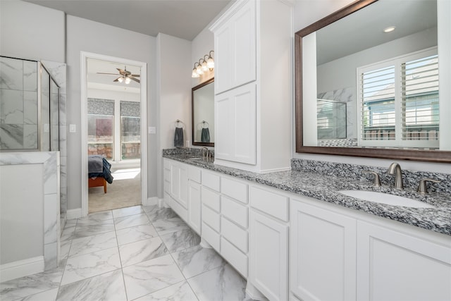 bathroom with walk in shower, vanity, and ceiling fan