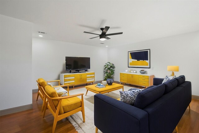 living room with hardwood / wood-style floors and ceiling fan