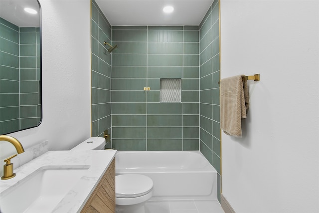 full bathroom with vanity, tile patterned floors, tiled shower / bath, and toilet