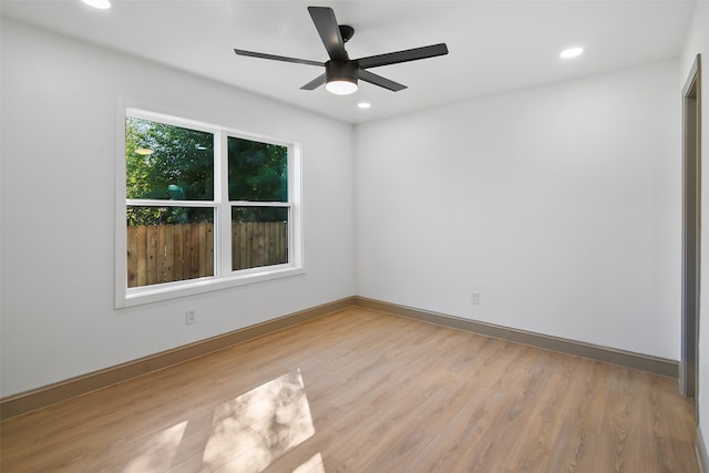 spare room with light hardwood / wood-style floors and ceiling fan